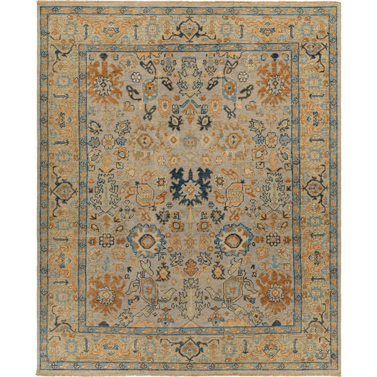 Reign Area Rug by Surya in blue, brown, peach, navy, light brown, denim. Made from new zealand wool in a unique style.