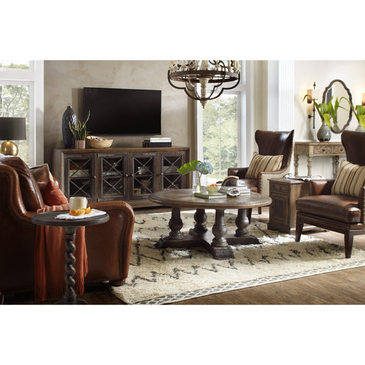 Pipe Creek Media Console by Hooker Furniture in saddle brown, anthracite black. Made from white oak veneers with antique seeded glass, metal in a rustic style.
