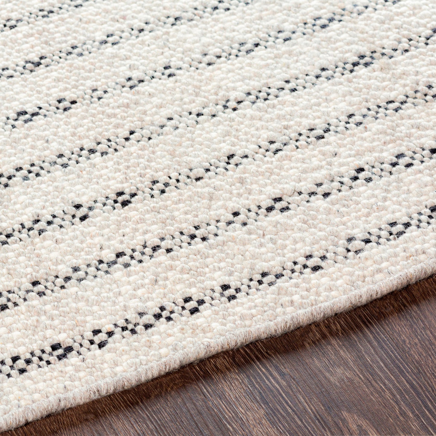 002 SI-1889626,SI-1889629,SI-1889630 | Closeup | Reliance Rug - 27893 by Surya in black, light gray, cream. Made from 100% wool in a unique style.