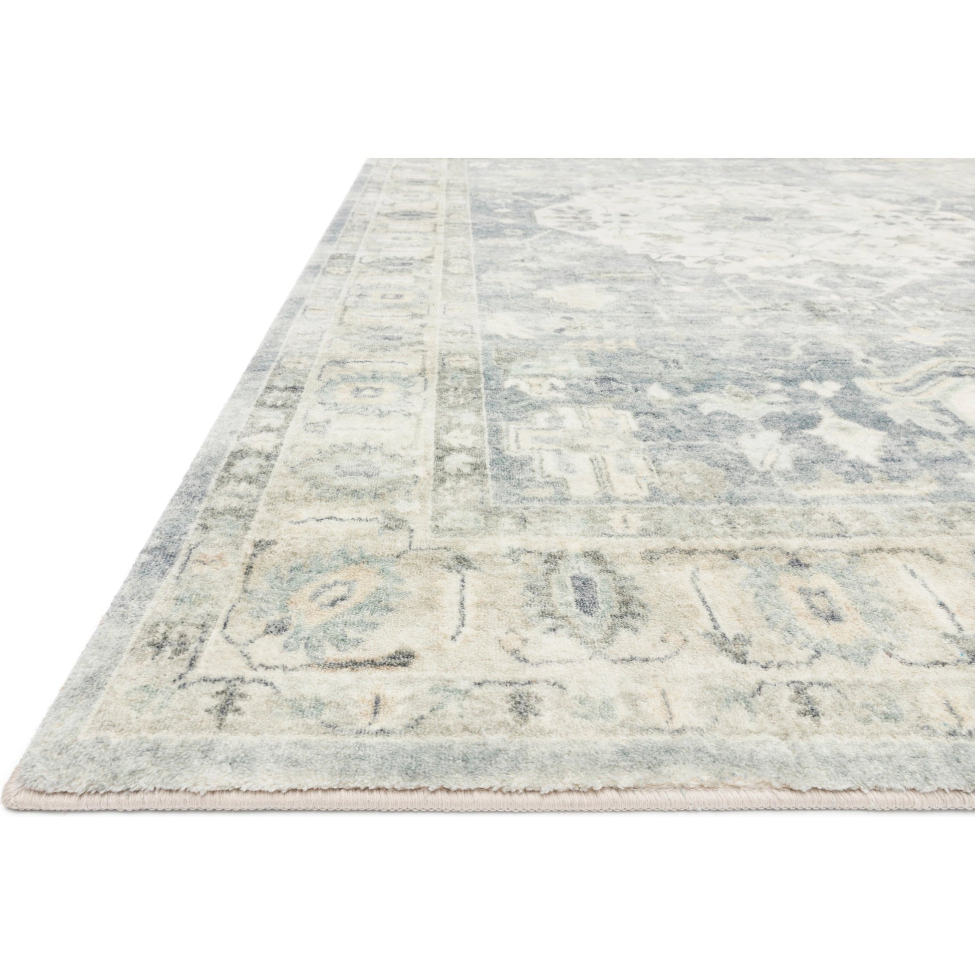ROS-07 by Loloi in denim, fog. Made from 100% polyester in a traditional style.