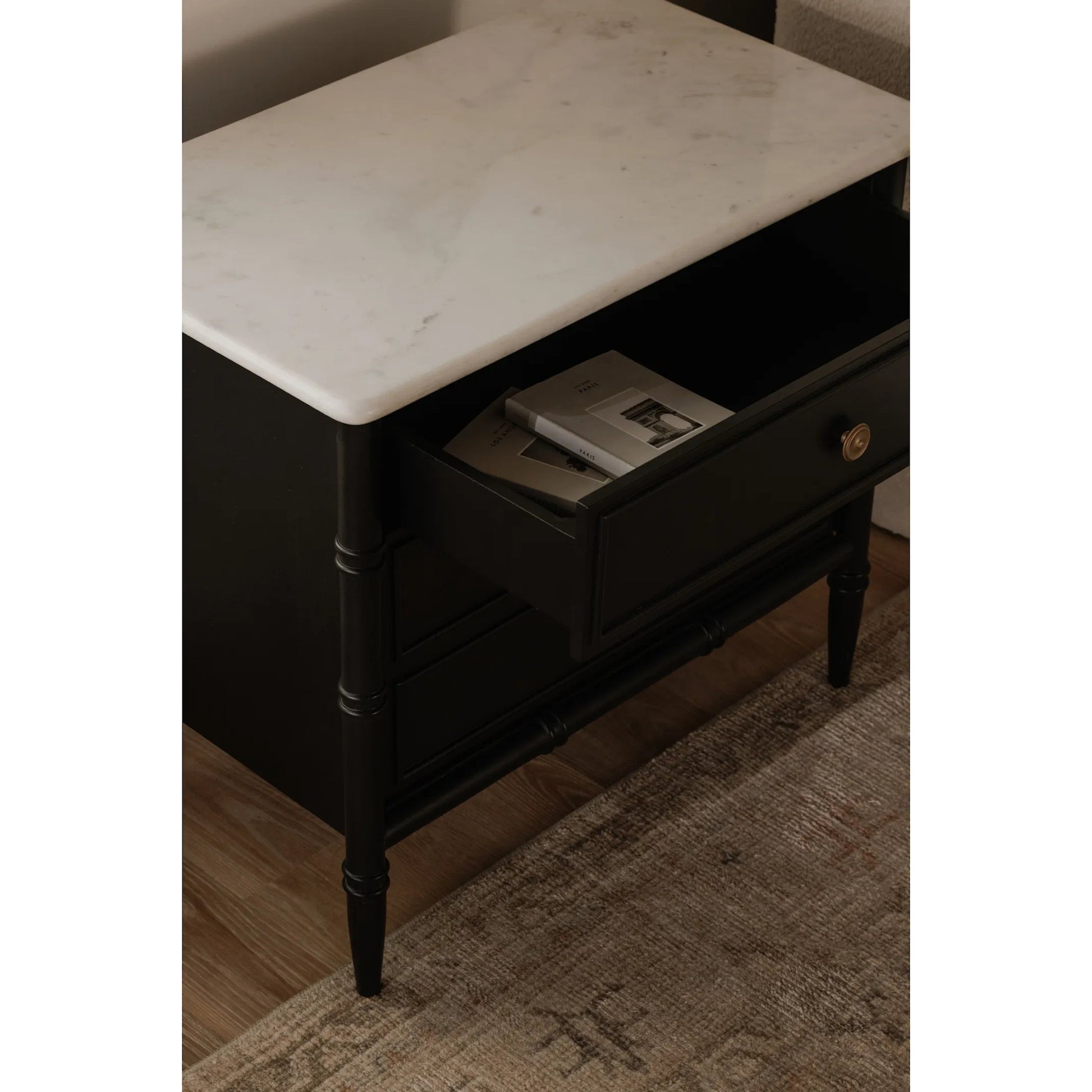 Eleanor Nightstand by Moe's Home Collection in black. Made from banswara marble top, mdf frame, case, drawers, solid mango wood legs in a traditional style.