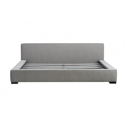 Zest Wide Upholstered Bed by Zest. Made from rubberwood, fabric in a modern style.