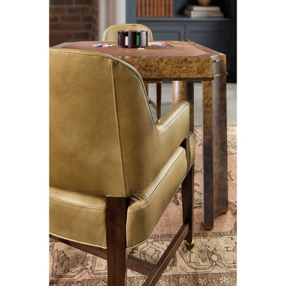 Archives Game Chair by Hooker Furniture in classic walnut, quartered walnut veneers. Made from wood, leather, hair on hide leather in a traditional style.
