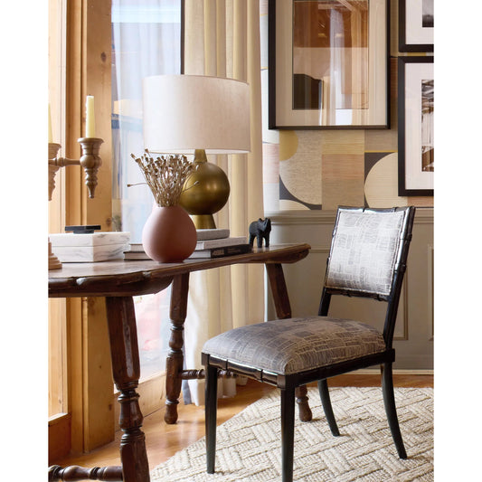 Rami Table Lamp by Currey and Company in antique brass. Made from aluminum in a eclectic & global style.