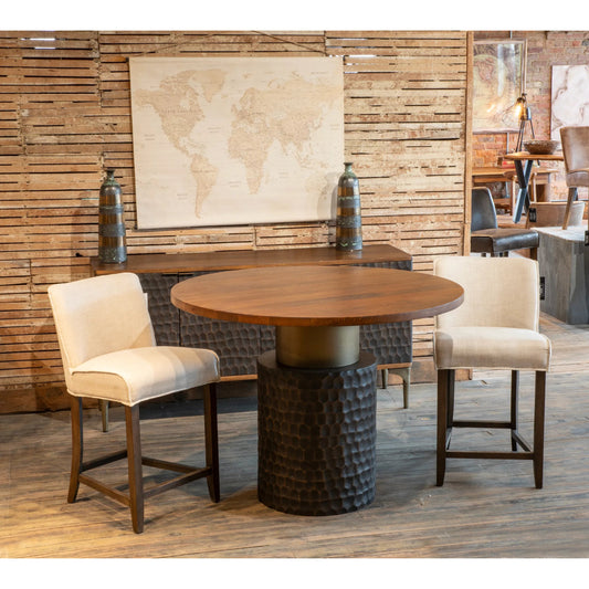 Vallarta 48" Carved Gathering Table by World Interiors in brown and two tone, bronze. Made from mango wood, cast aluminum in a unique style.
