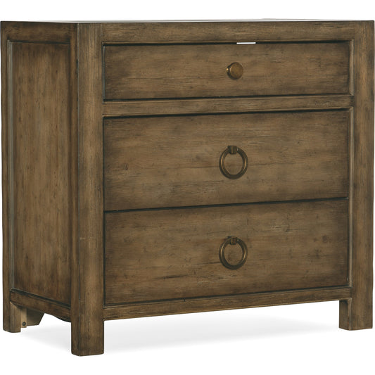 Sundance Three Drawer Nightstand by Hooker Furniture in cliffside. Made from pecan veneers, cedar, felt panel, outlet, self-closing undermount drawer guides, solid-wood edge top in a traditional style.
