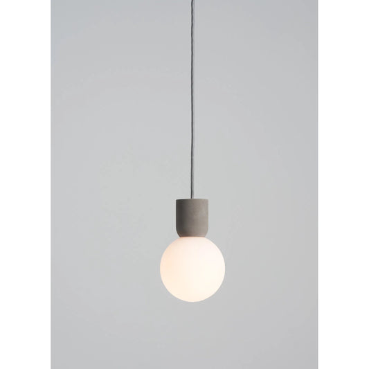 Castle Glo Pendant by Seed Design in concrete/opal glass. Made from concrete, mouth-blown glass in a modern style.