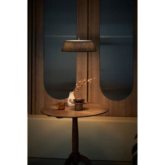 Halo Pendant by Seed Design in black with black shade. Made from pleated fabric, steel, aluminum in a unique style.