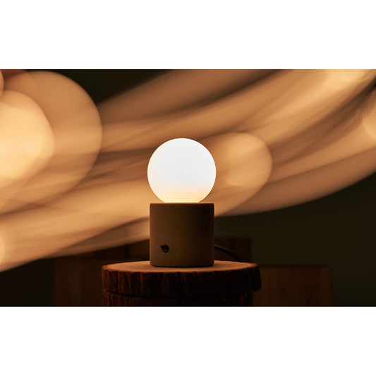 Castle Muse Table Lamp by Seed Design in concrete gray, matte opal glass. Made from concrete, glass in a modern style.