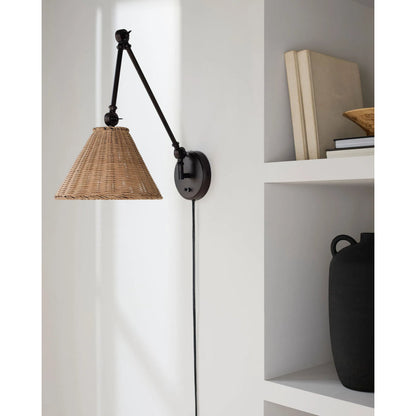 Semilla Wall Sconce Swing Arm by Livabliss in fixture: black; shade: brown; cord: white and paintedpaintedmetallic. Made from iron, rattan in a rustic style.