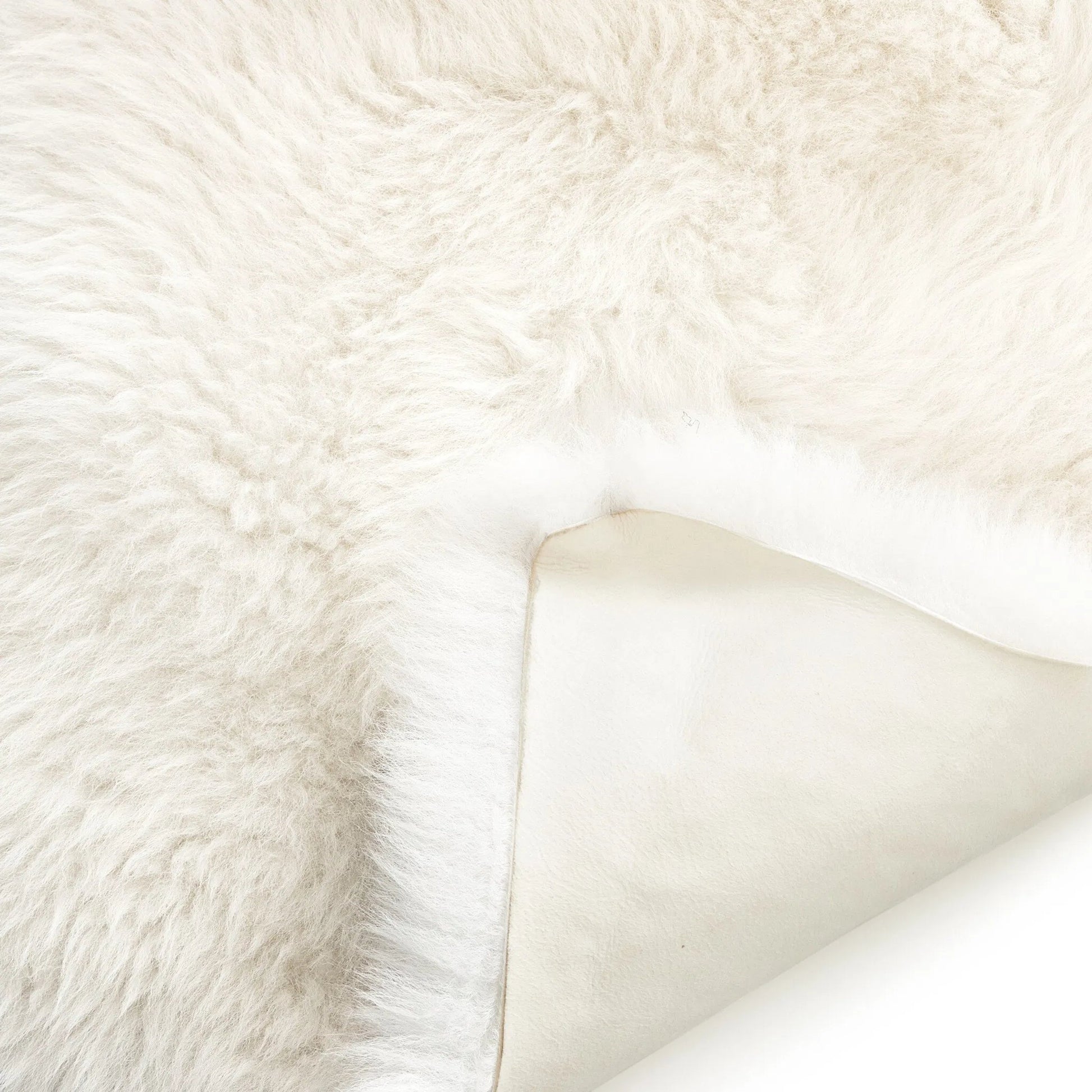 Lalo Lambskin Throw by Four Hands. Made from shearling in a rustic style.