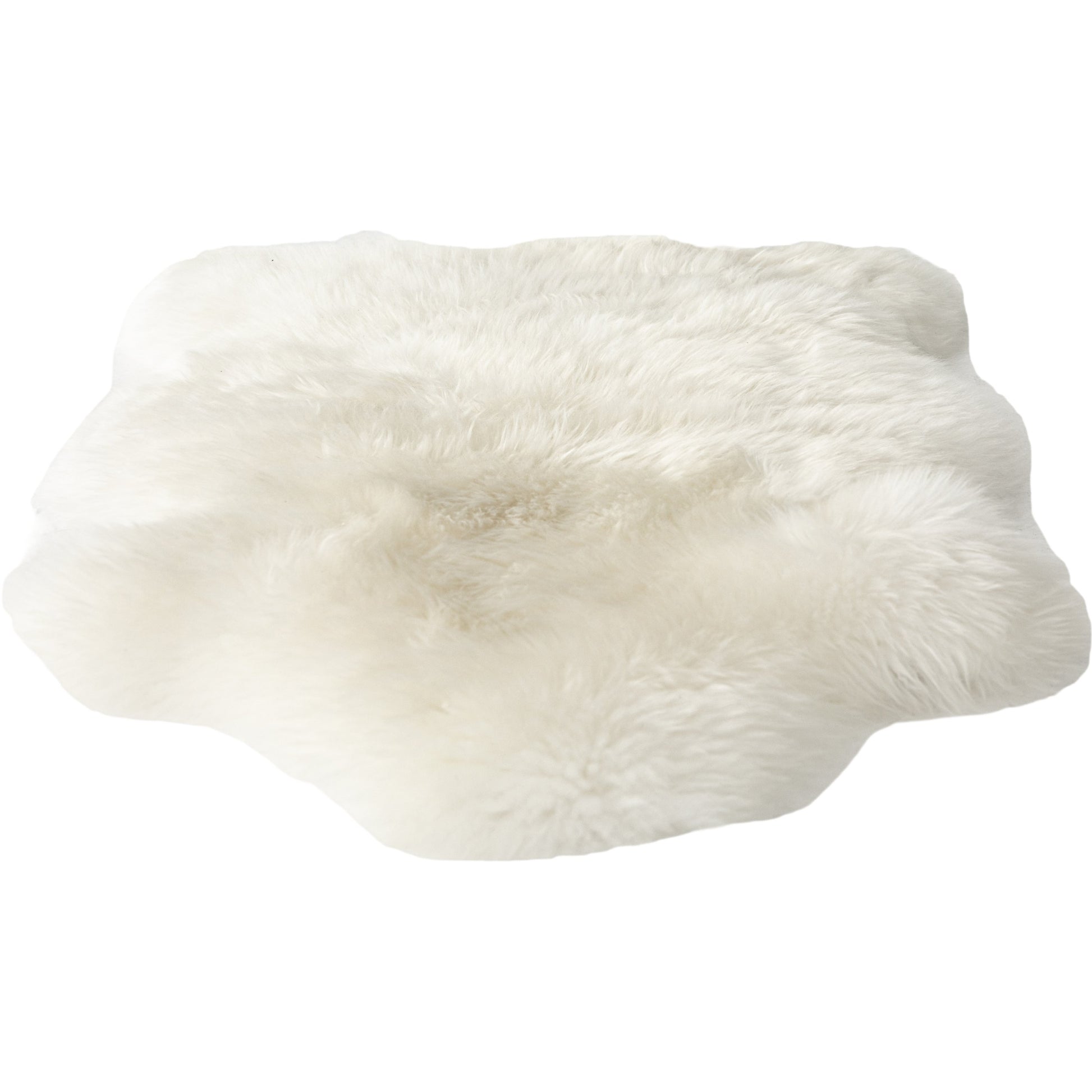 Lalo Lambskin Throw by Four Hands. Made from shearling in a rustic style.
