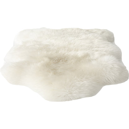 Lalo Lambskin Throw by Four Hands. Made from shearling in a rustic style.