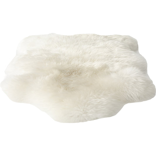 Lalo Lambskin Throw by Four Hands. Made from shearling in a rustic style.