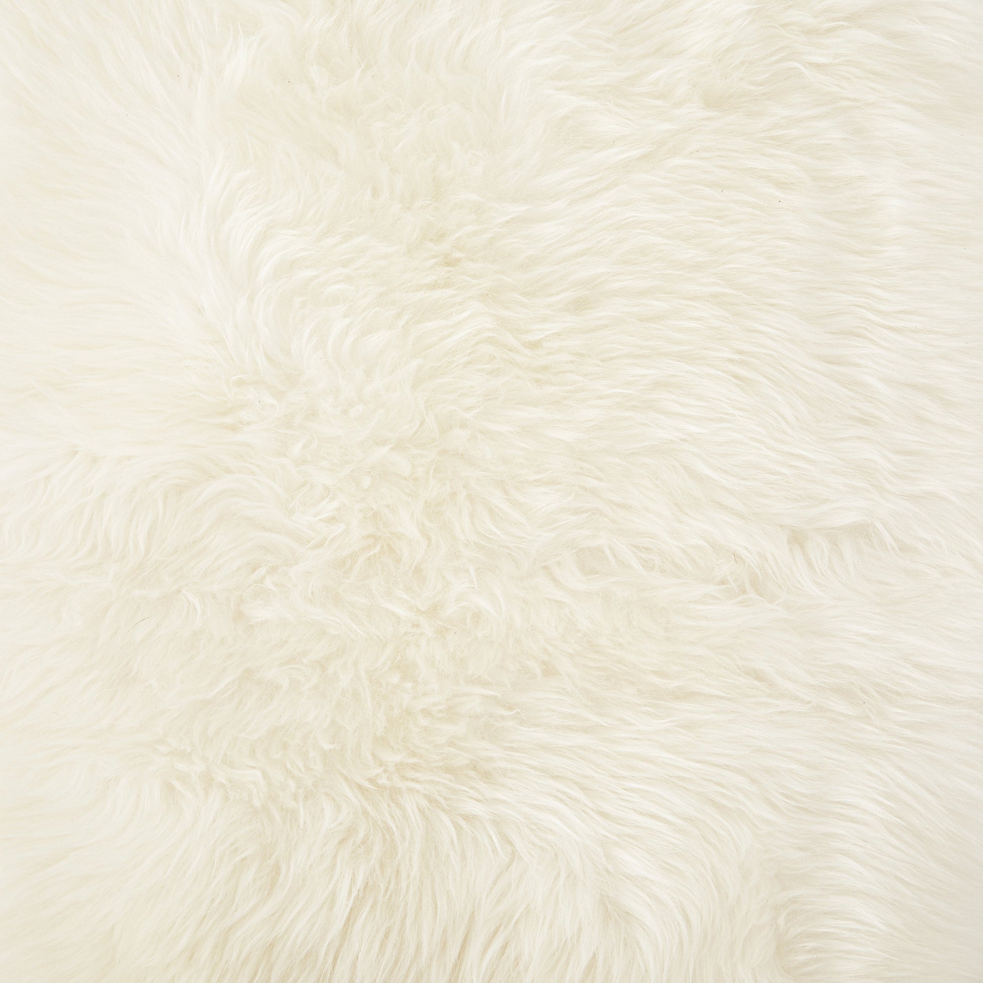 Lalo Lambskin Throw by Four Hands. Made from shearling in a rustic style.