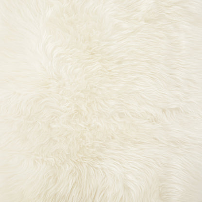 Lalo Lambskin Throw by Four Hands. Made from shearling in a rustic style.
