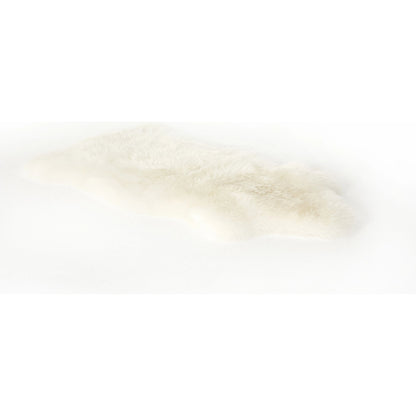 Lalo Lambskin Throw by Four Hands. Made from shearling in a rustic style.