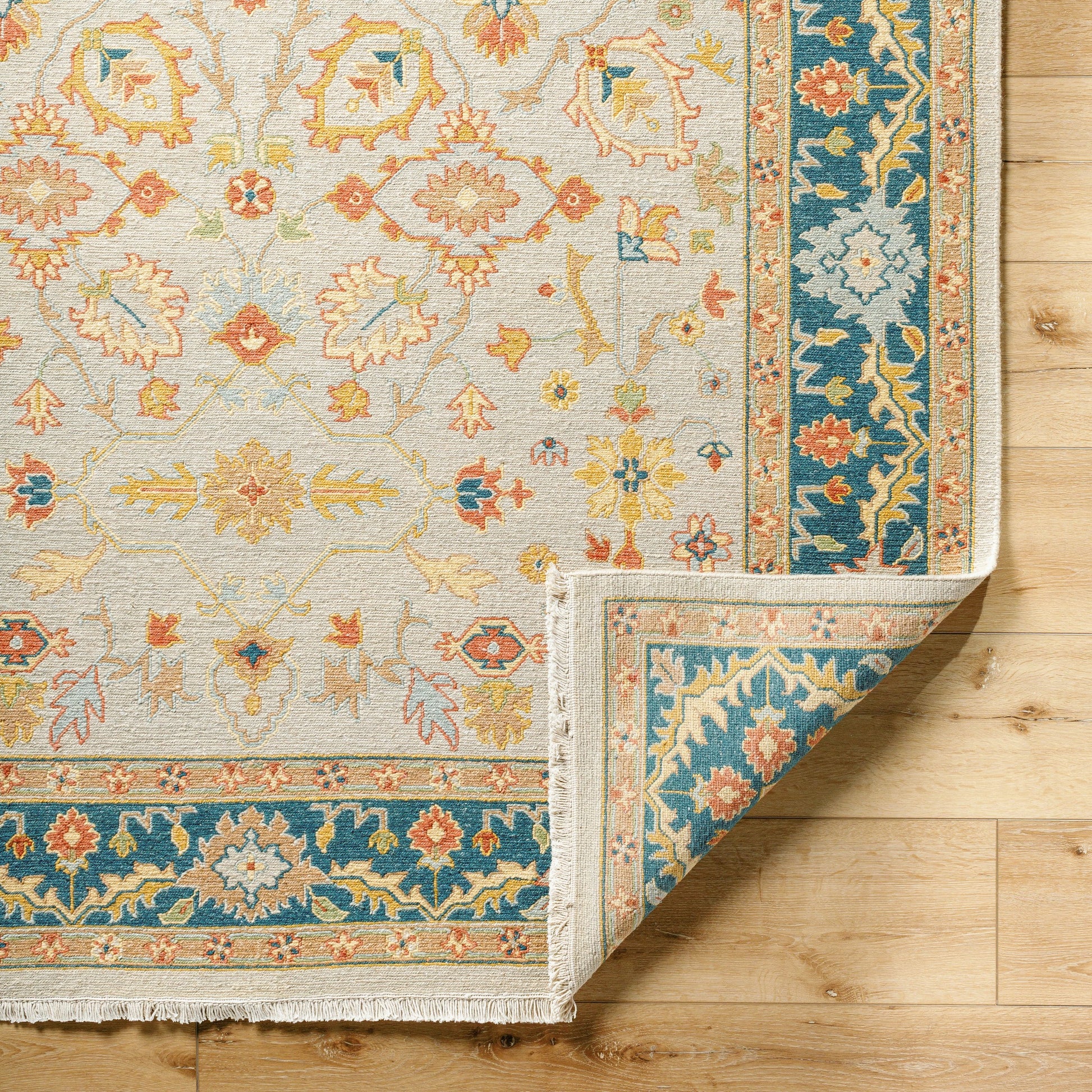 Soumek Rug - 29995 by Surya in teal, burnt orange, mustard, ice blue, tan, beige. Made from 70% wool, 30% viscose in a unique style.