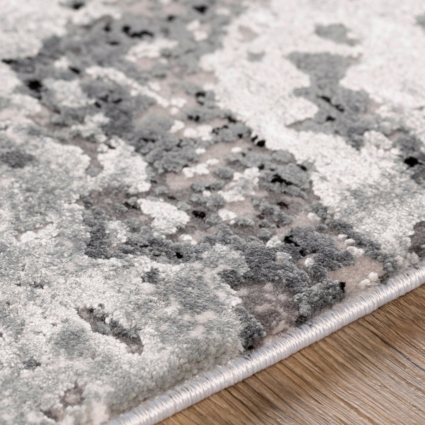 006 SI-1890710,SI-1890711,SI-1890712,SI-1890713,SI-1890714 | Closeup | Solar Rug - 25676 by Surya in gray, light gray, charcoal, black. Made from 70% viscose, 30% acrylic in a unique style.