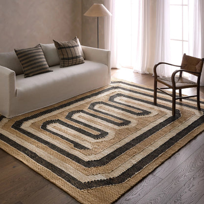 Song Of The Sahara SOS02 Rug by Jaipur Living in tan, beige, black. Made from 100% jute in a unique style.