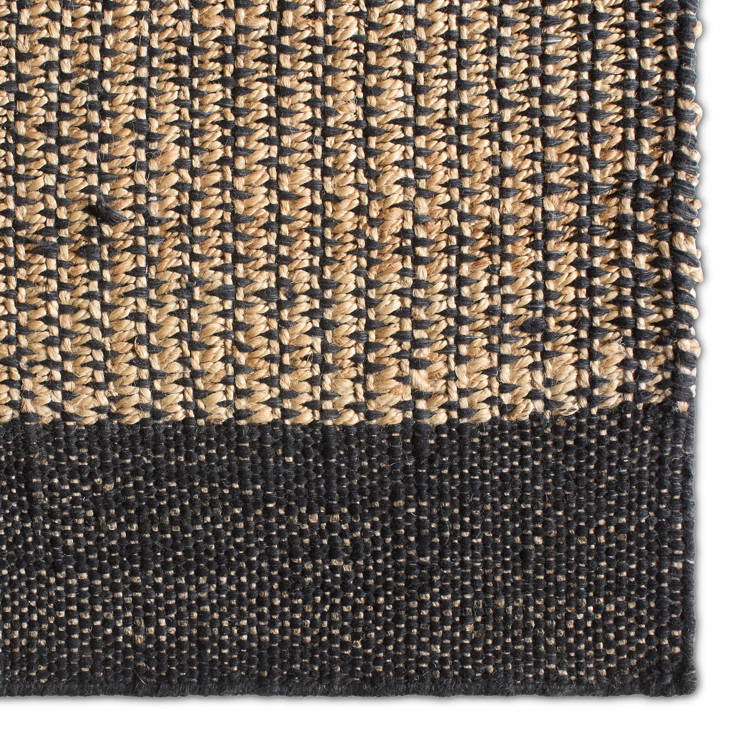 002 SI-2531426,SI-2531427,SI-2531428,SI-2531429,SI-2531430,SI-2531431,SI-2531432 | Primary Silo | Song Of The Sahara SOS03 Rug by Jaipur Living in black, tan, beige. Made from 80% jute 20% wool in a unique style.