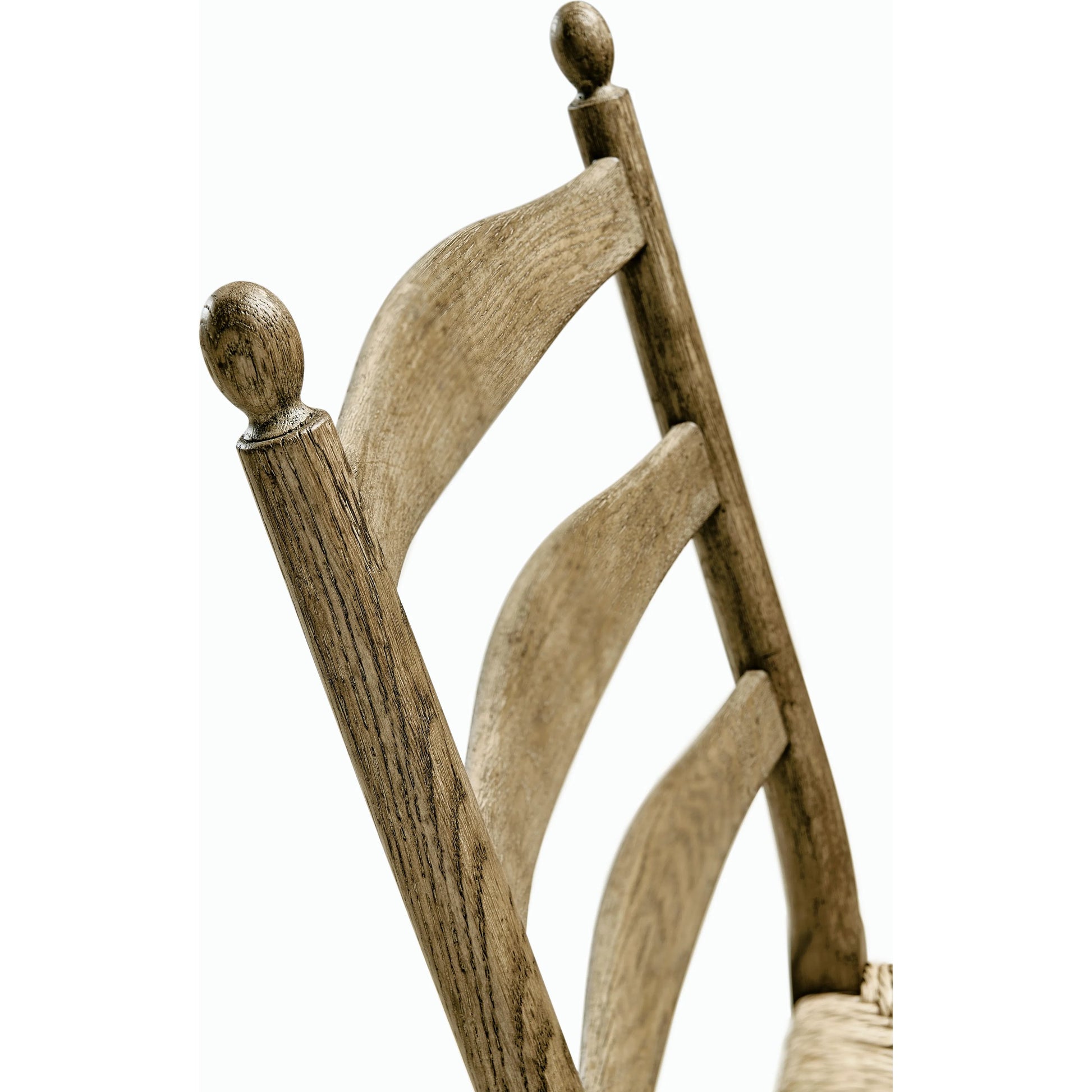 Timeless Doppler Ladderback Side Chair by Jonathan Charles in brown. Made from oak, fiber rush, foam, fabric in a coastal style.