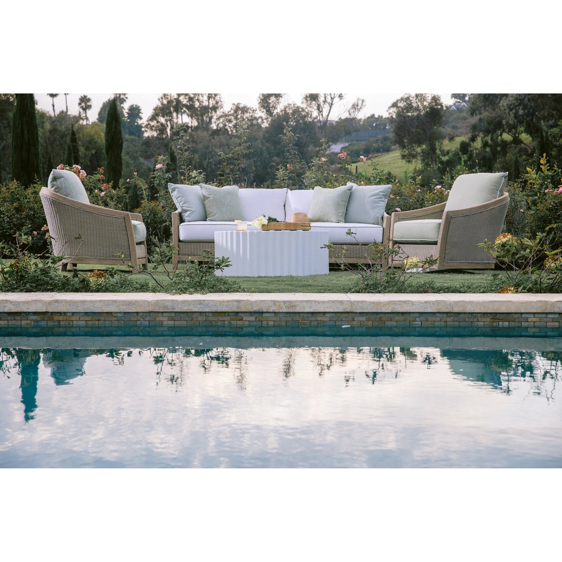 Cambria Outdoor Sofa by Sunset West in light wood. Made from teak in a rustic style.