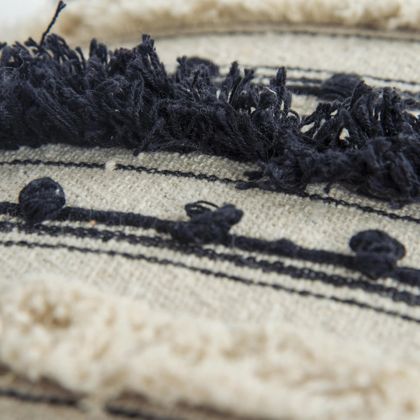 002 SI-2438423 | Closeup | Beadle Pillow by HedgeApple Essentials in black. Made from polyester, cotton in a rustic style.