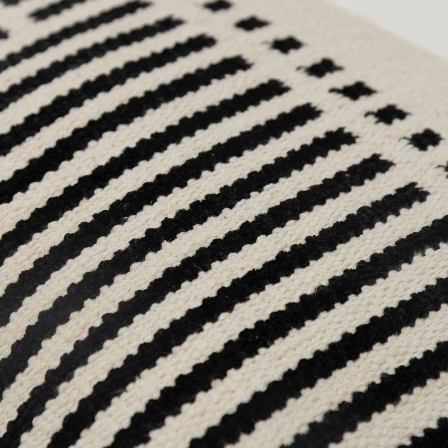 002 SI-2438434 | Closeup | Clifton Pillow by HedgeApple Essentials in black. Made from cotton, rayon in a modern style.
