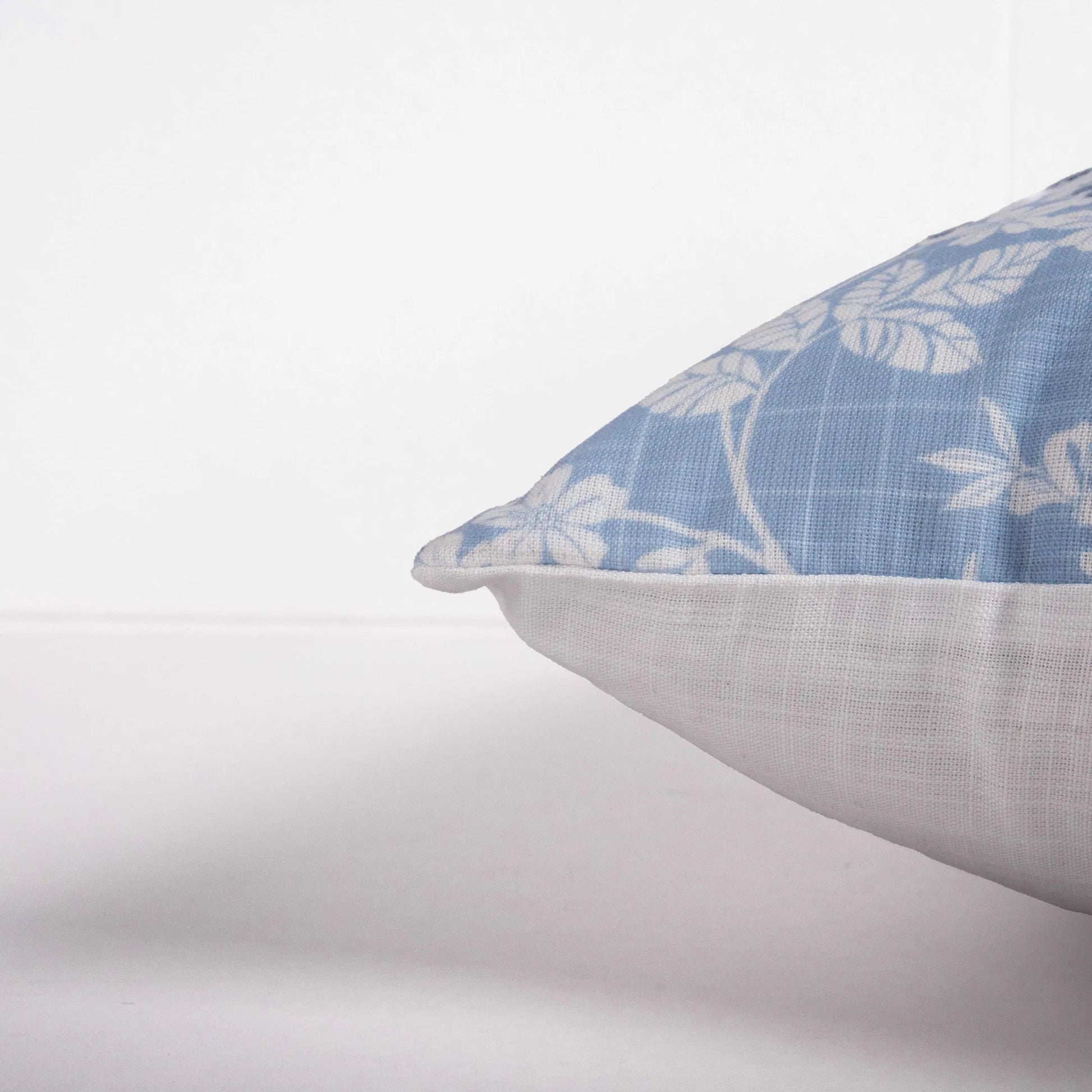 Crisp Indoor/Outdoor Pillow by HedgeApple Essentials in cornflower blue, ivory, blue. Made from polyester, polyester slub in a traditional style.
