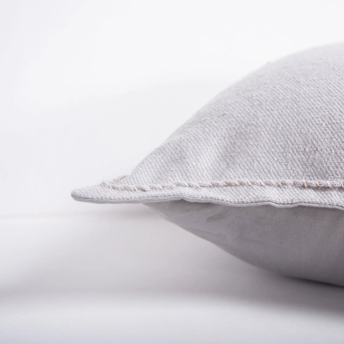 007 SI-2295753,SI-2295946 | Closeup | Walker Pillow by HedgeApple Essentials in grey. Made from cotton in a transitional style.