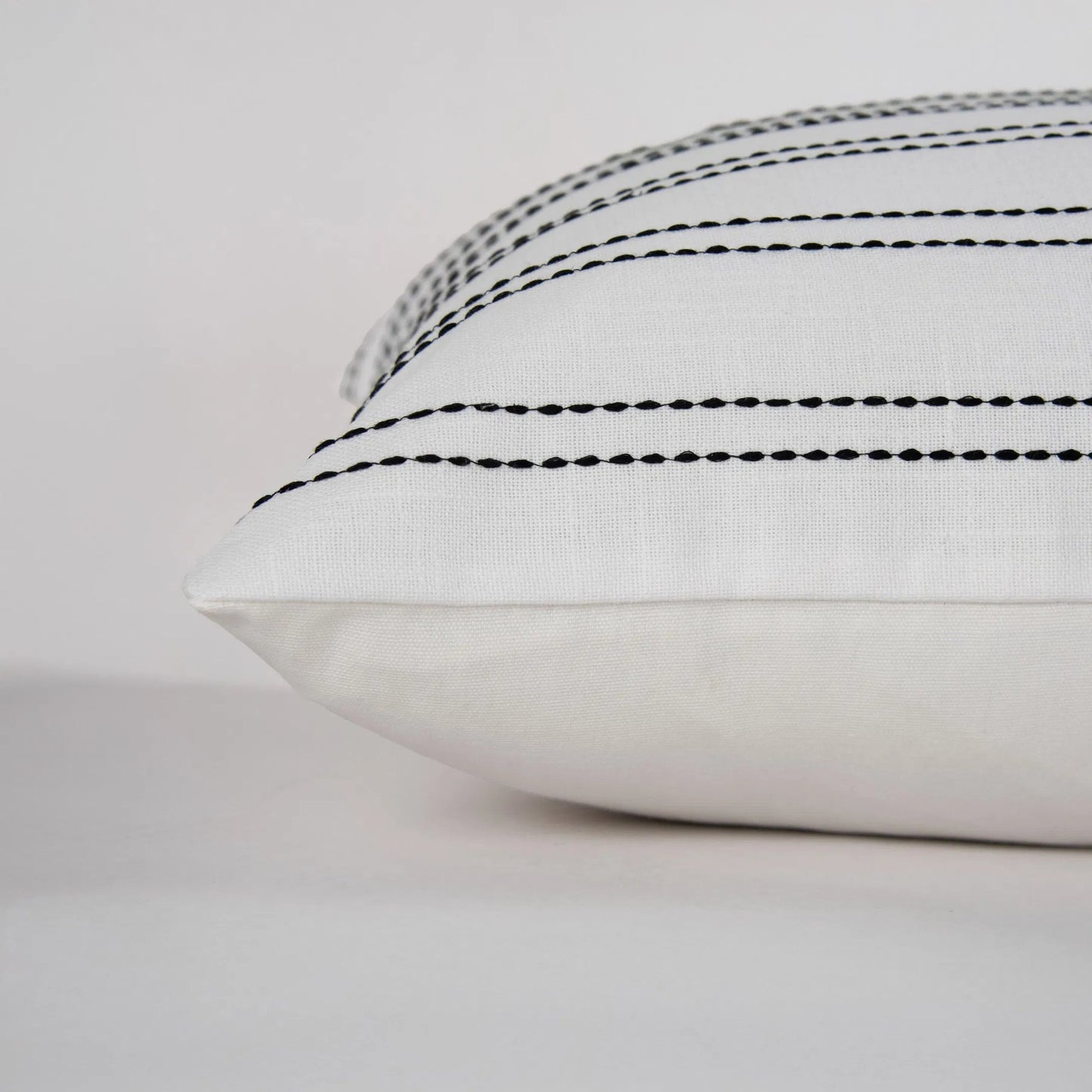 004 SI-2295957 | Closeup | Burr Pillow by HedgeApple Essentials in white, black. Made from polyester, cotton slub in a transitional style.