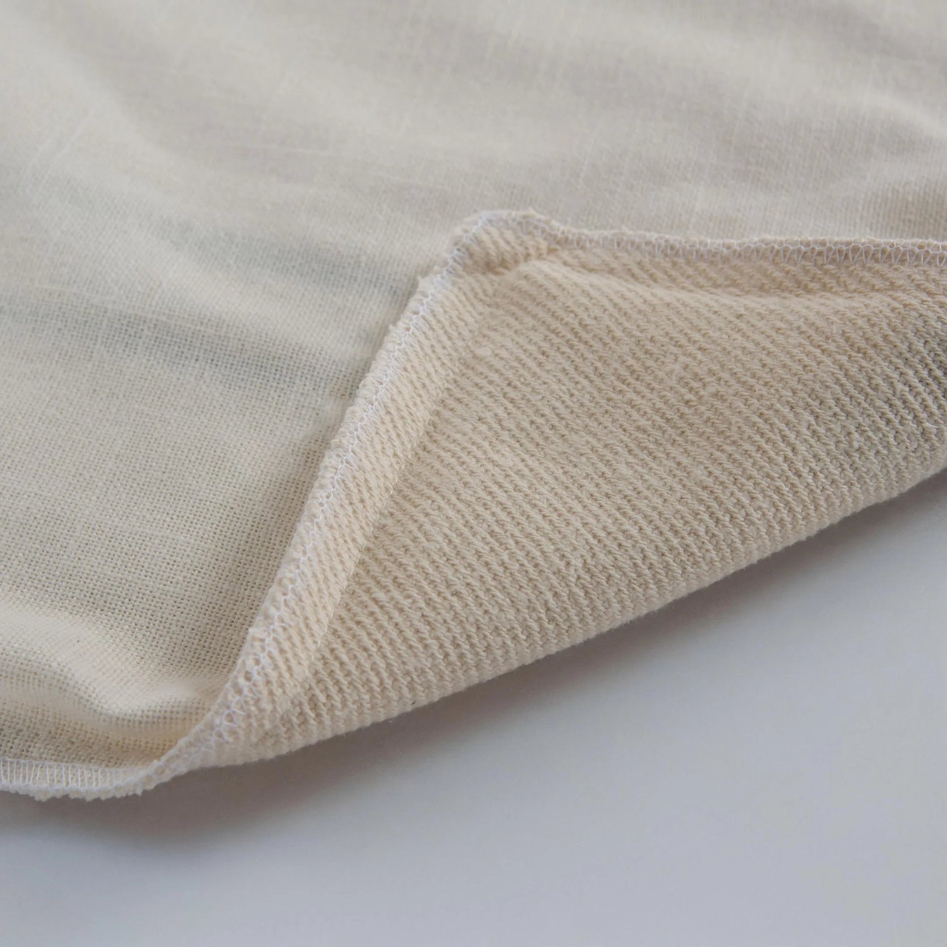 Borden Pillow by HedgeApple Essentials in black, ivory. Made from cotton boucle in a transitional style.