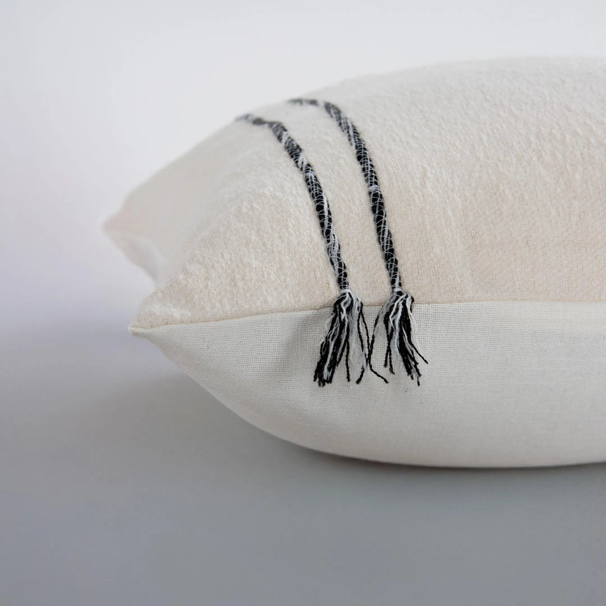 Borden Pillow by HedgeApple Essentials in black, ivory. Made from cotton boucle in a transitional style.