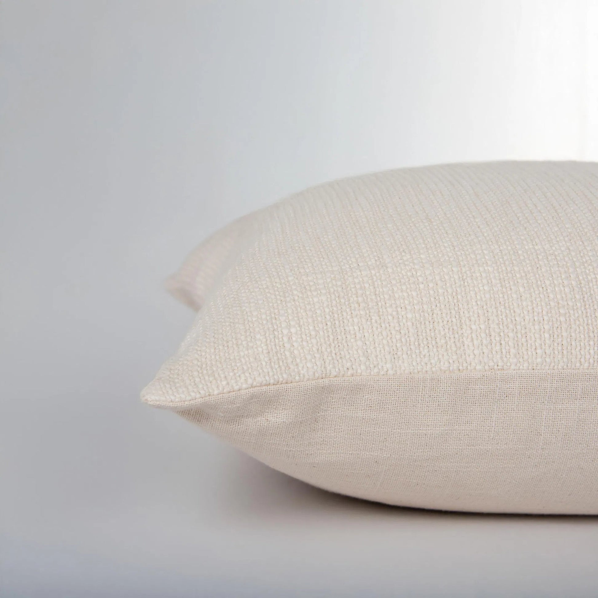 Oconto Pillow by HedgeApple Essentials in natural, brown. Made from yarn dyed cotton woven in a transitional style.
