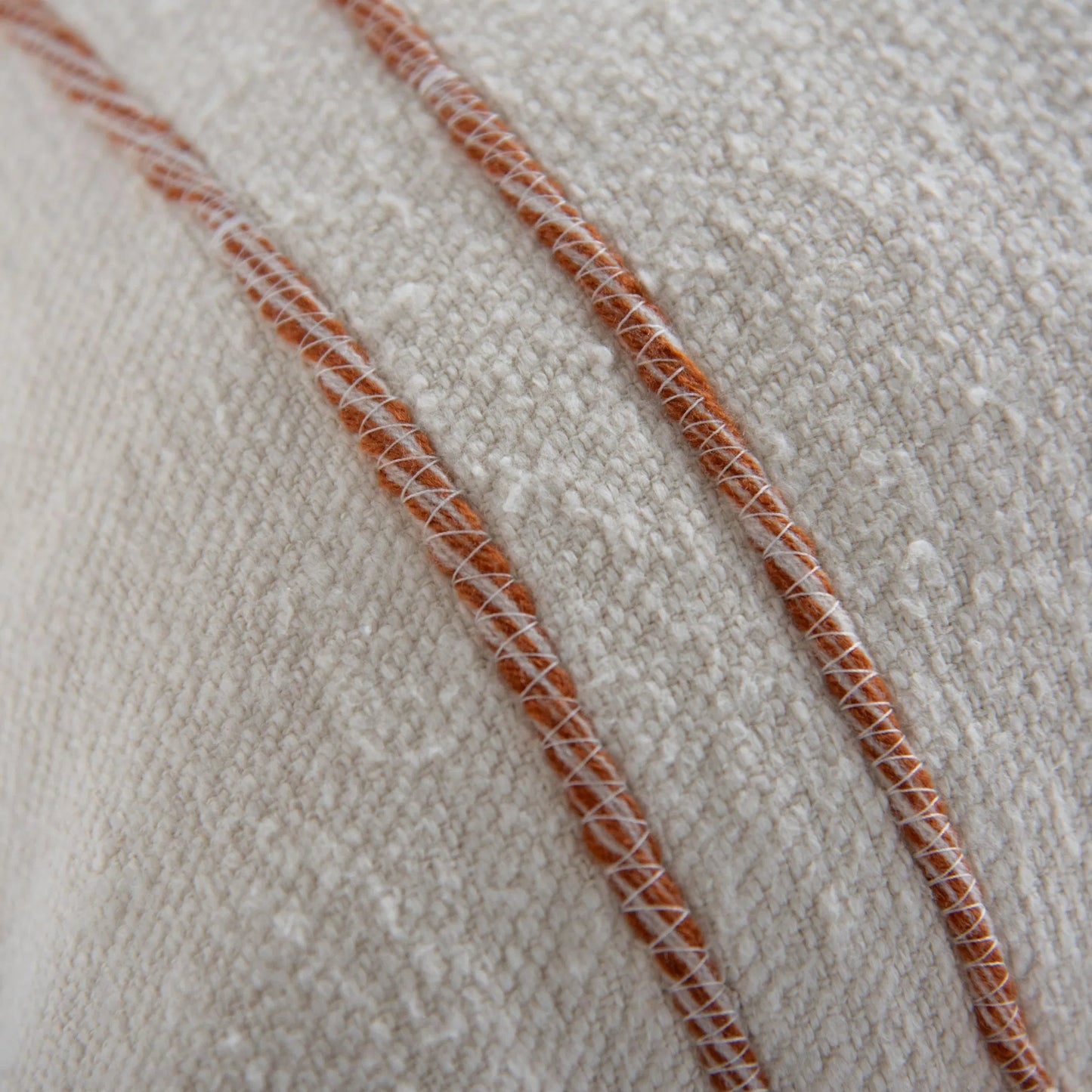 002 SI-2438632 | Closeup | Albany Pillow by HedgeApple Essentials in ivory, terra cotta. Made from cotton boucle in a transitional style.