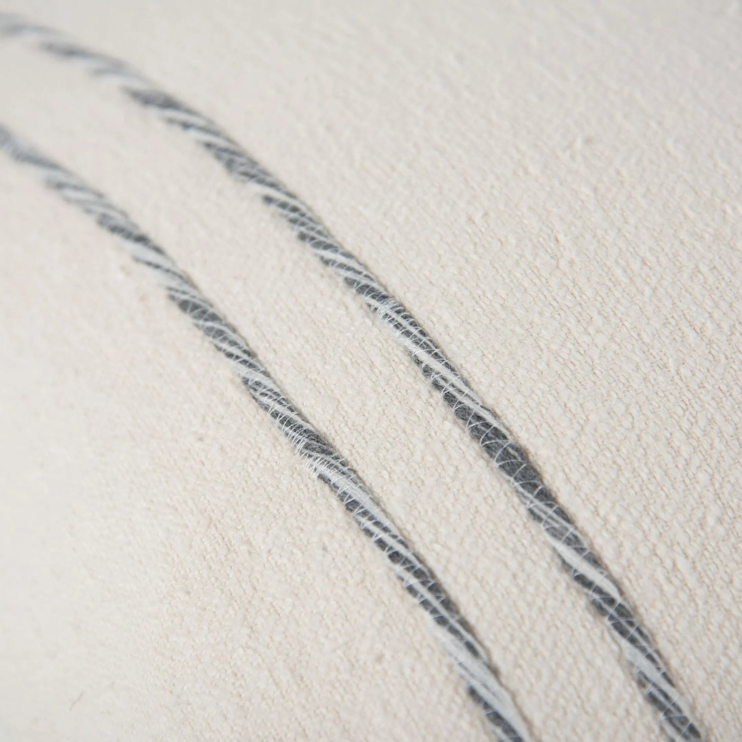 002 SI-2295978 | Closeup | Tama Pillow by HedgeApple Essentials in dark grey, ivory. Made from cotton boucle in a transitional style.