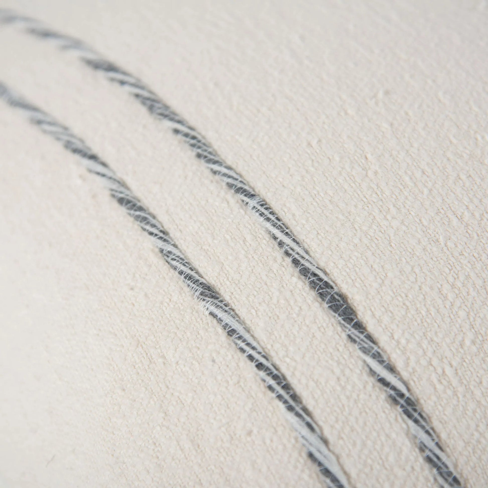 Tama Pillow by HedgeApple Essentials in dark grey, ivory. Made from cotton boucle in a transitional style.