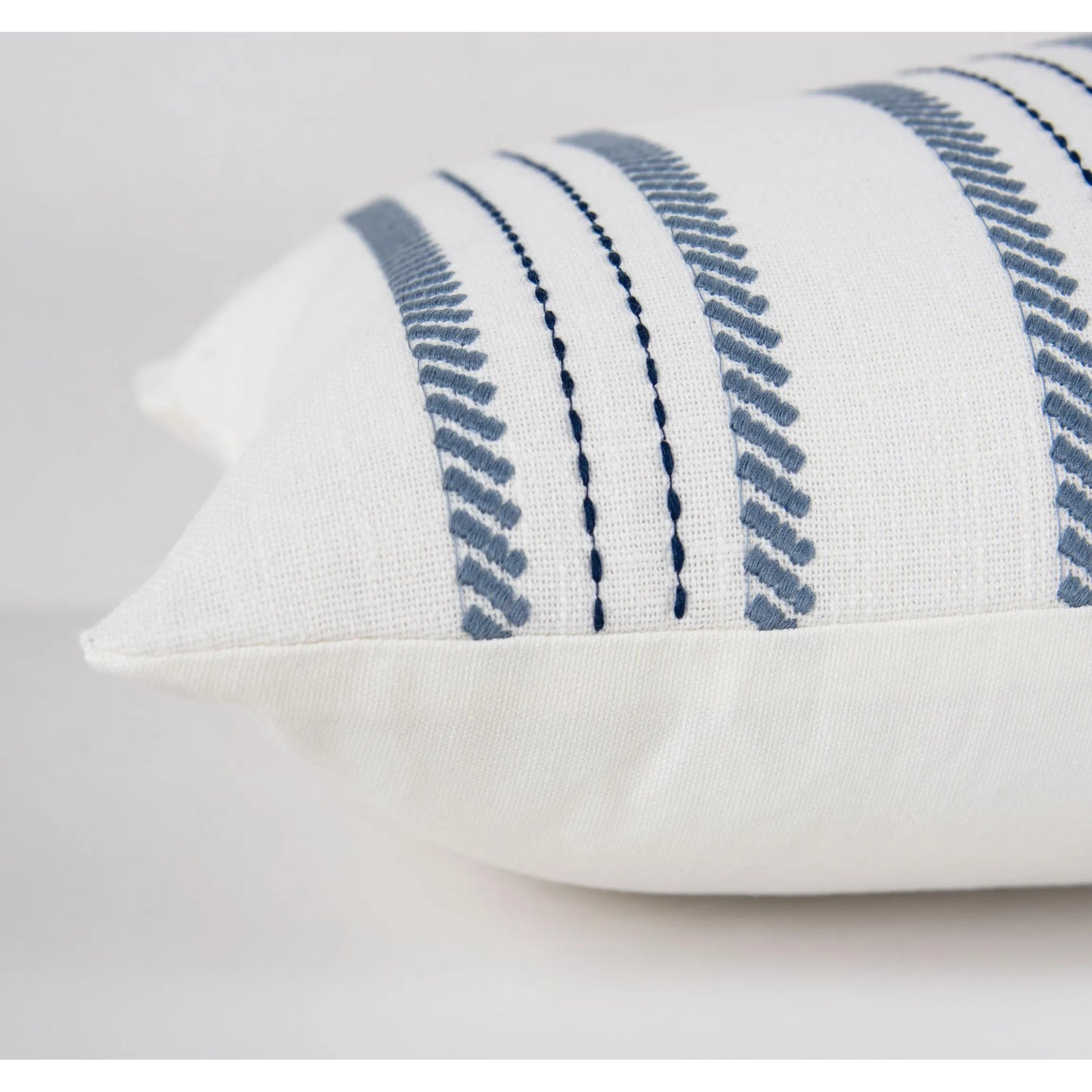 004 SI-2295990,SI-2438462 | Closeup | Wexford Pillow by HedgeApple Essentials in blue, navy, white. Made from polyester, cotton slub in a transitional style.