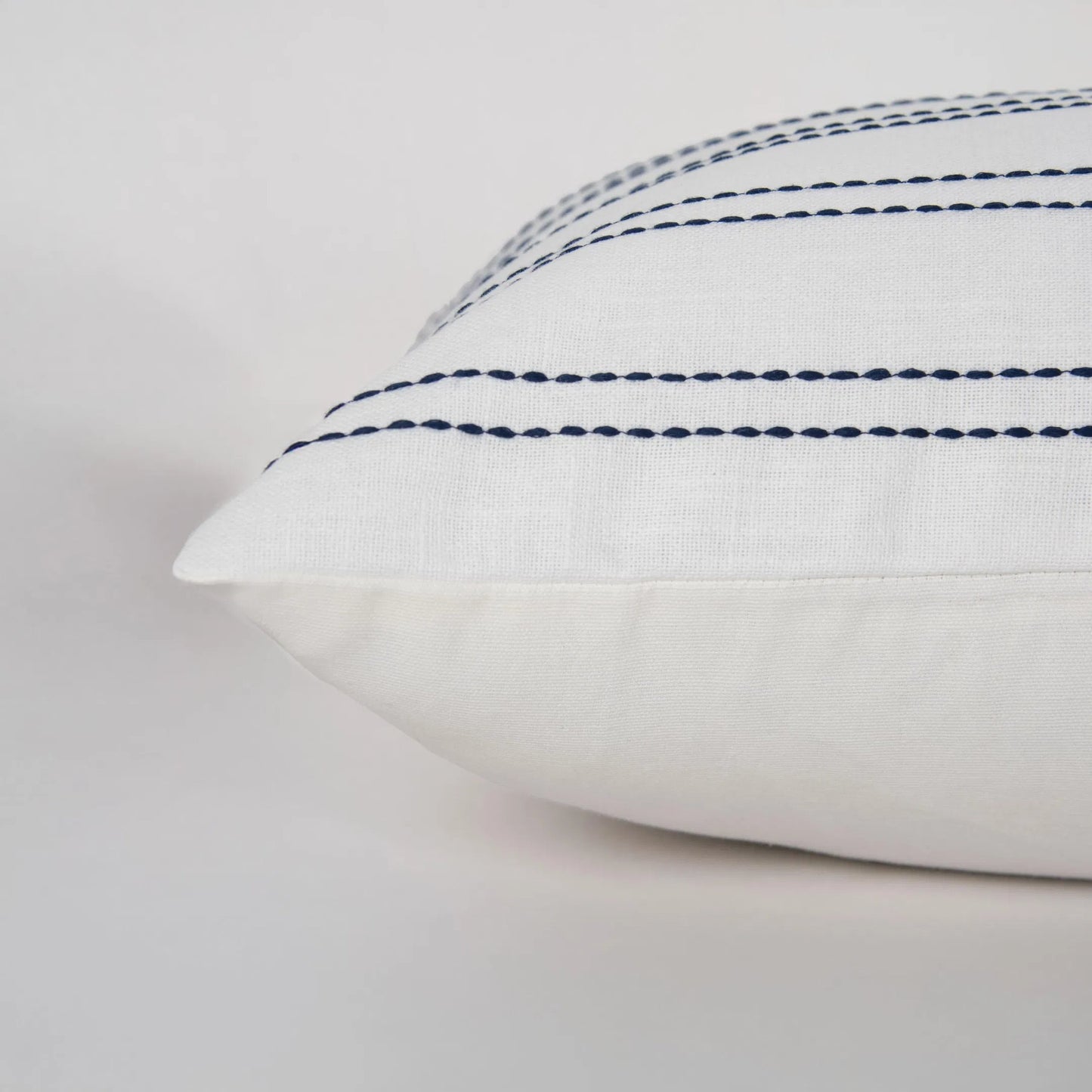 004 SI-2438463 | Closeup | Maricopa Pillow by HedgeApple Essentials in blue, navy, white. Made from polyester, cotton slub in a transitional style.