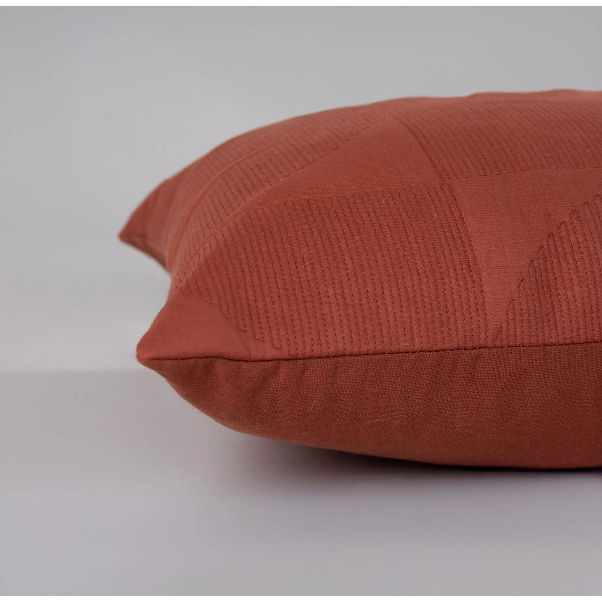 Sierra Pillow by HedgeApple Essentials in red, orange, rust, terra cotta. Made from polyester, cotton voile in a modern style.