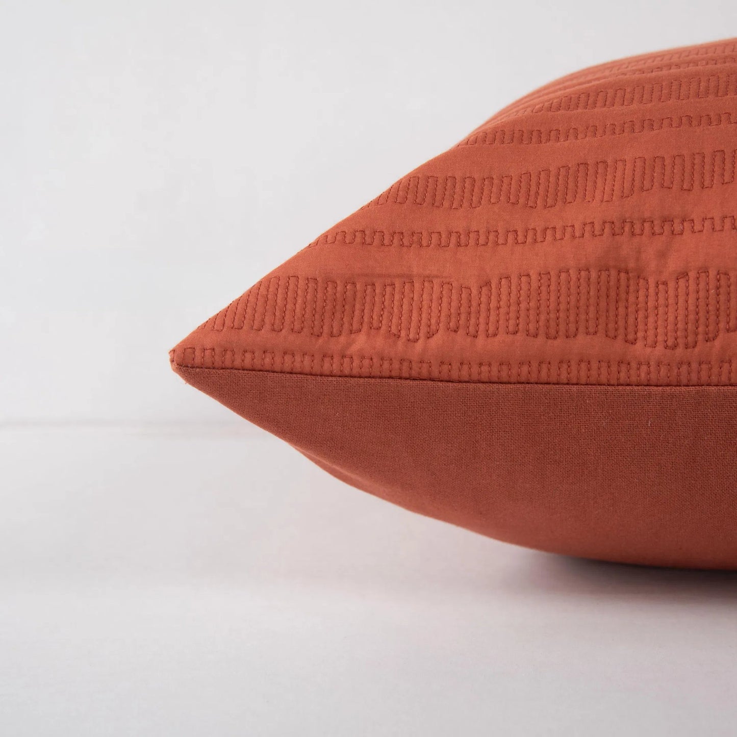 004 SI-2296011,SI-2438529 | Closeup | Kanabec Pillow by HedgeApple Essentials in rust. Made from polyester, cotton voile in a eclectic & global style.