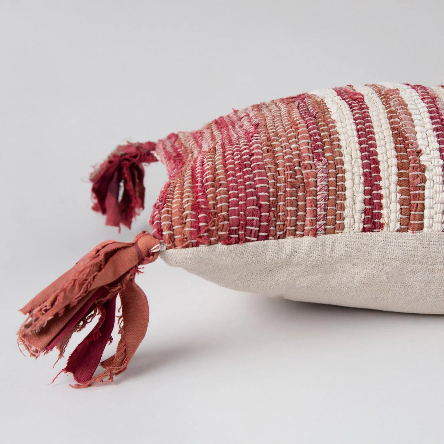 003 SI-2438923,SI-2438924,SI-2438925 | Closeup | Apache Pillow by HedgeApple Essentials in red, berry. Made from recycled denim in a rustic style.