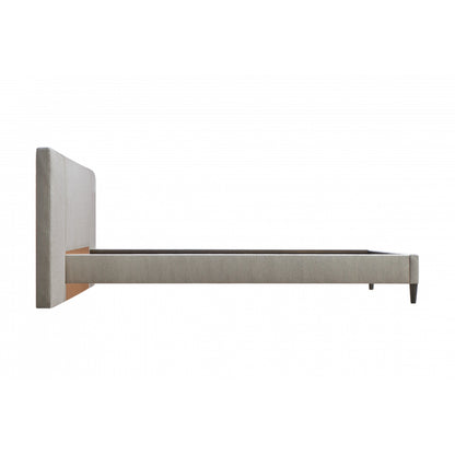 Zest Upholstered Bed with Wings by Zest. Made from rubberwood, fabric in a modern style.