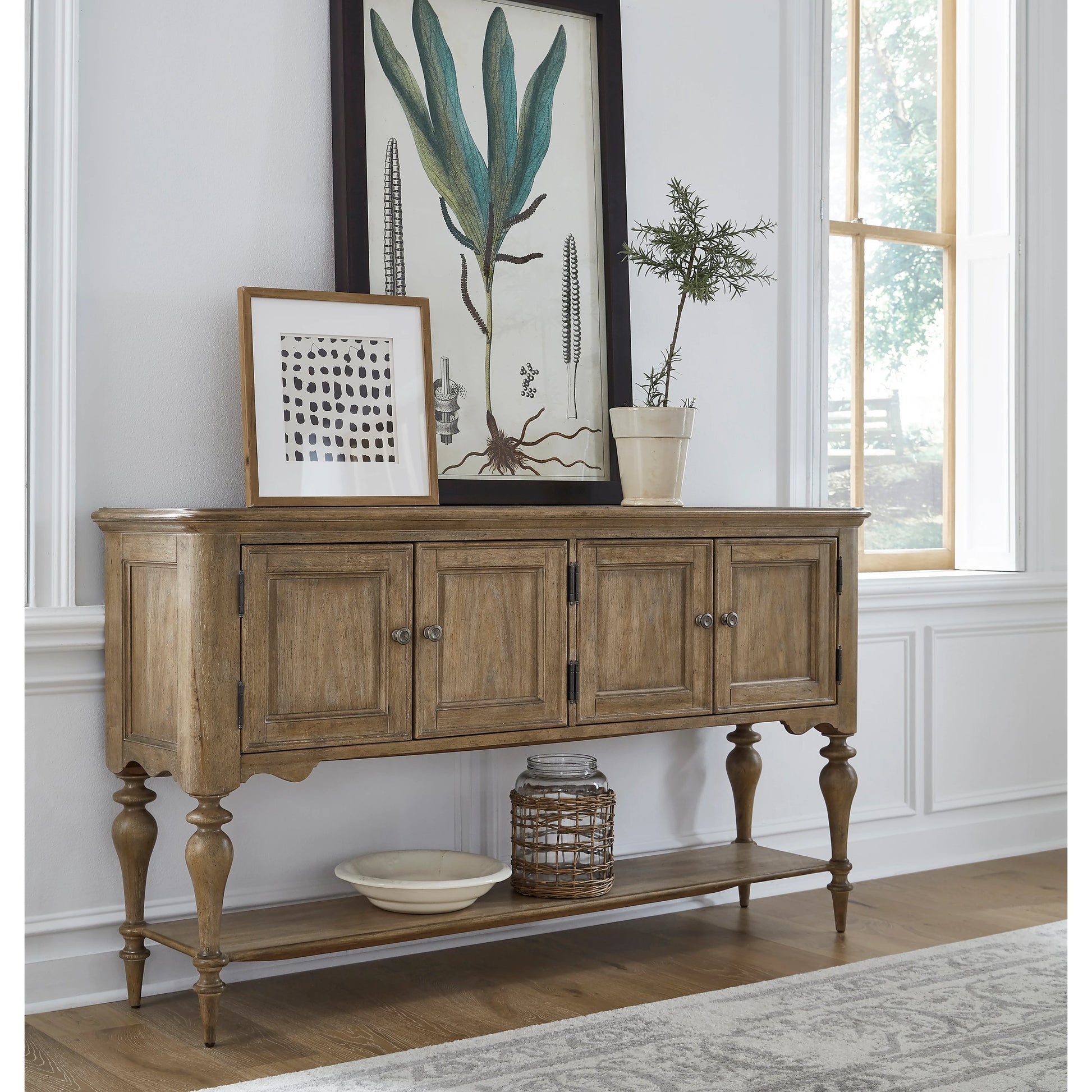 Weston Hills Sideboard by Pulaski Furniture in flax seed. Made from hardwood solids, hickory veneers in a traditional style.