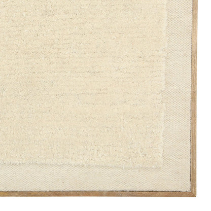 Tiffani by Arch & Plane in textured art in a natural wood float frame. Made from woven wool rug, wood frame in a transitional style.