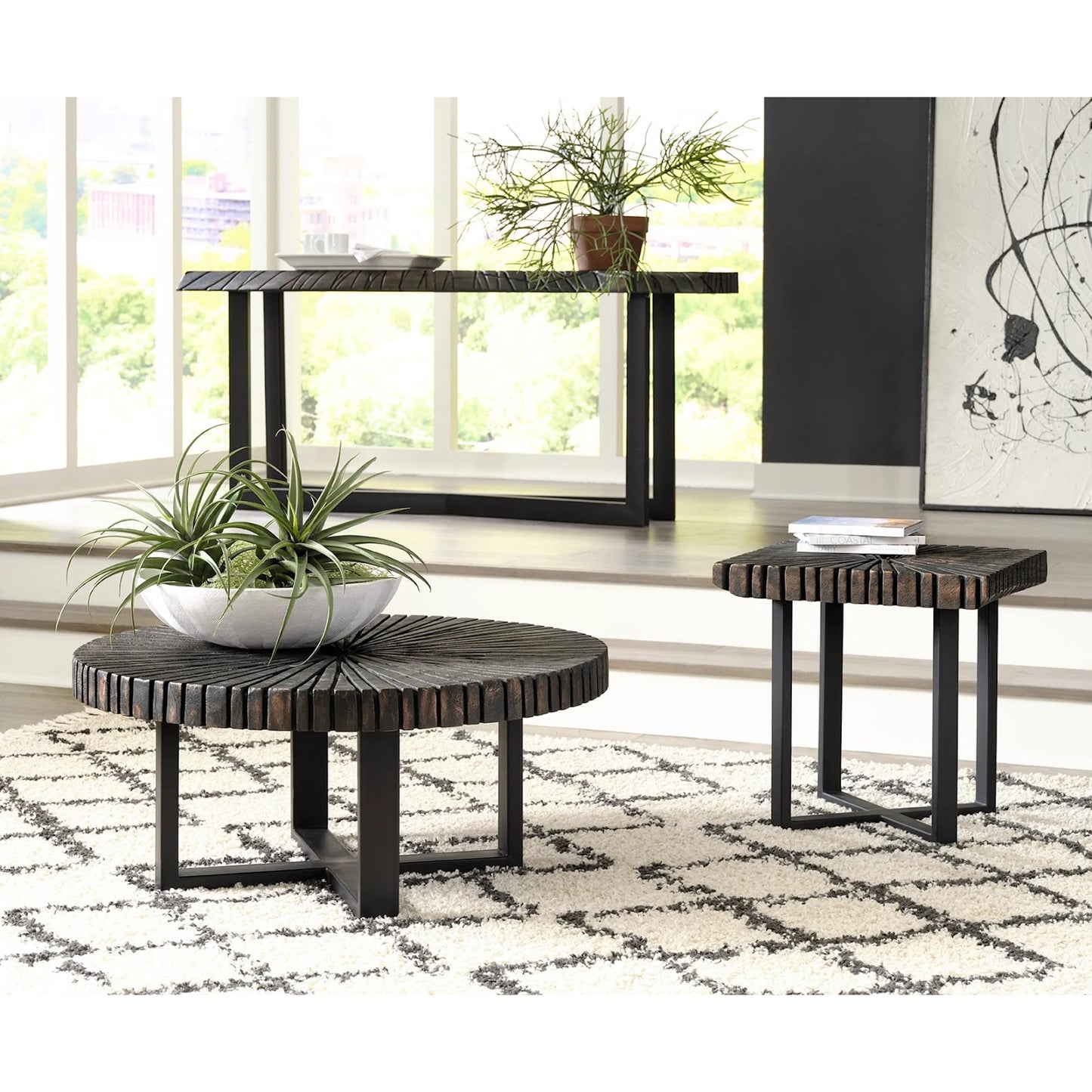 002 SI-1944806 | Lifestyle | Chainsaw Round Coffee Table by Phillips Collection in black. Made from wood, chamcha wood, metal, iron in a modern style.