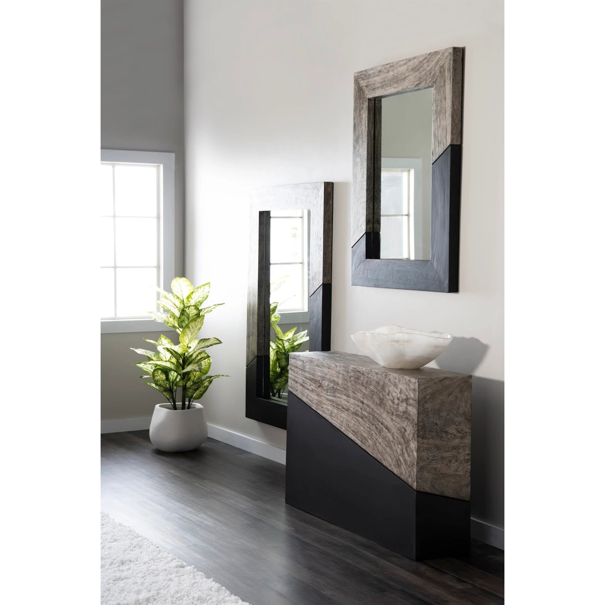 Geometry Console Table by Phillips Collection in gray stone. Made from wood in a rustic style.