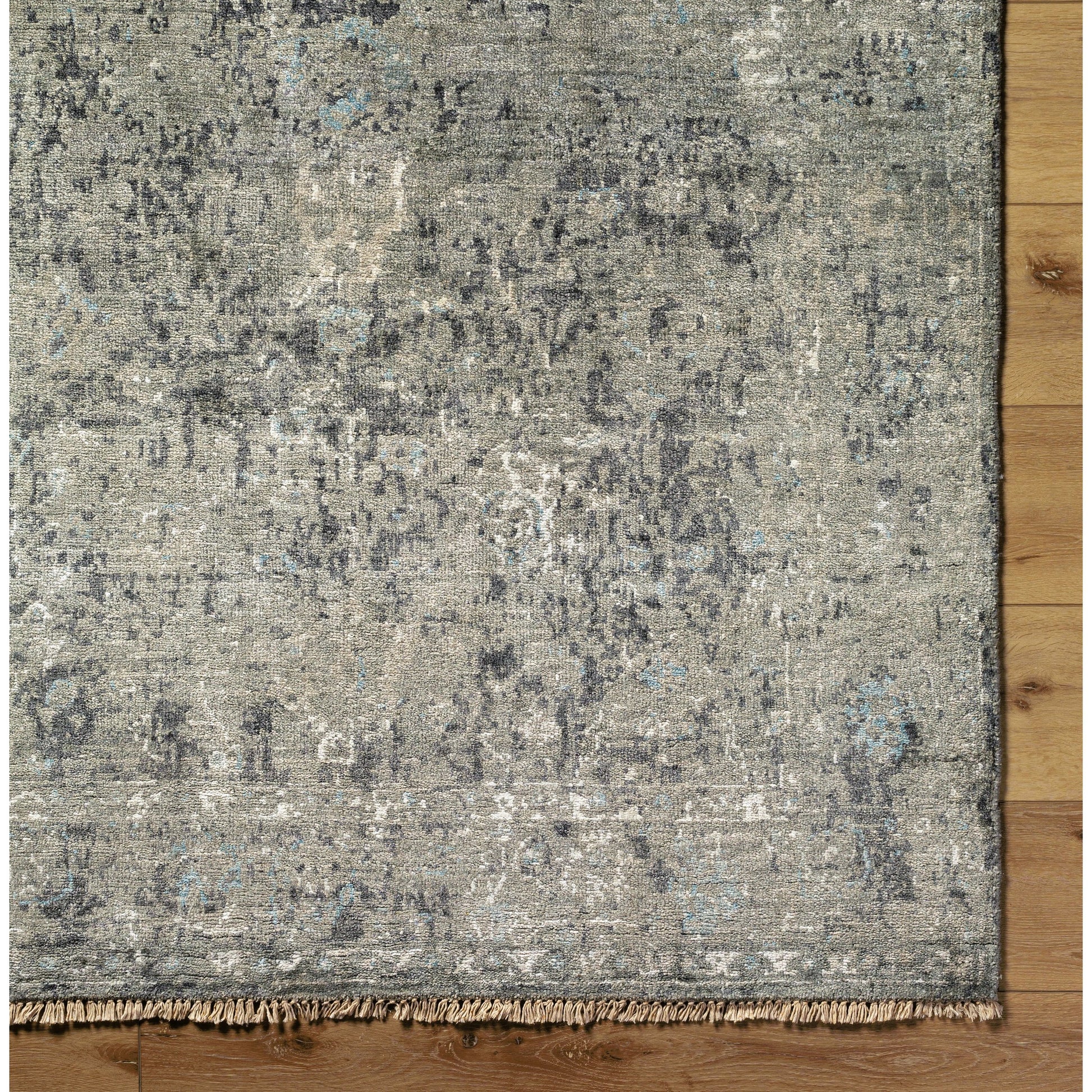 Theodora Rug - 30279 by Surya in charcoal, ice blue, gray, medium gray, light gray, black. Made from 100% viscose in a unique style.