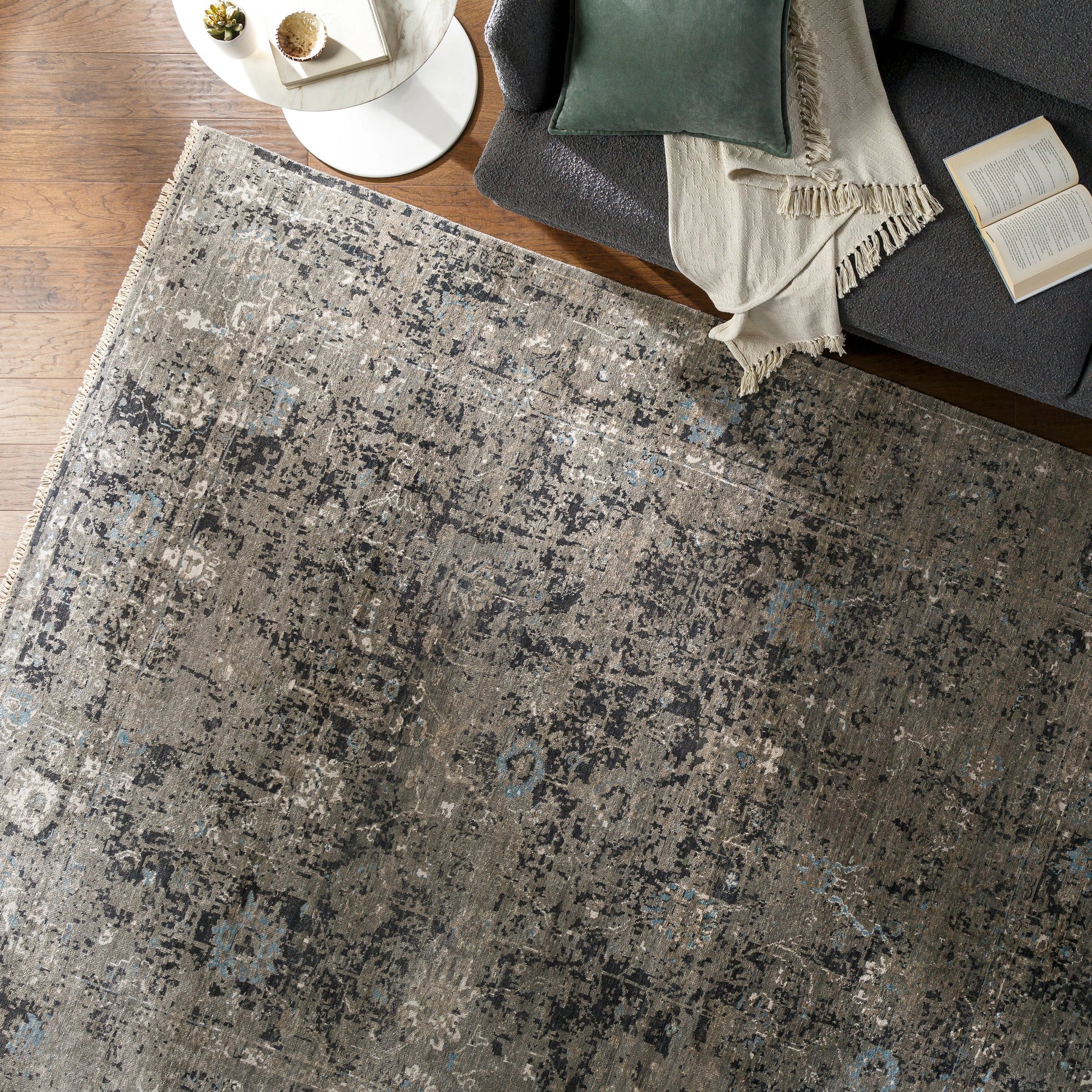 Theodora Rug - 30279 by Surya in charcoal, ice blue, gray, medium gray, light gray, black. Made from 100% viscose in a unique style.